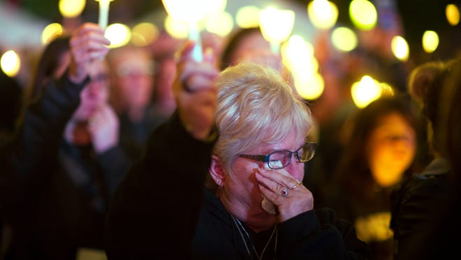 Susan Harris, of Spartansburg, S.C., wipes tears away during the National Law Enforcement Officers Memorial Fund 30th annual Candlelight Vigil. Harris lost her son Jason Harris, a Spartansburg police officer, when he was killed in the line of duty April 13, 2017.