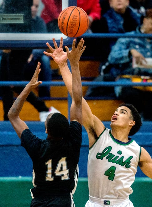 Peoria Notre Dame´s Noah Reynolds (4) defends a shot from Manual´s Orlando Brown in the second half Tuesday, Jan. 14, 2020 at PND High School. [MATT DAYHOFF/JOURNAL STAR]