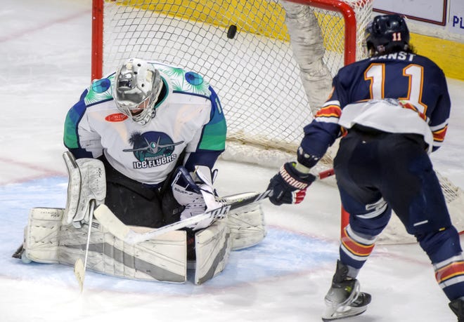 Peoria's Jordan Ernst (11) puts the puck past Pensacola goaltender Stephen Mundinger in the third period of Game 2 of the first round of the SPHL playoffs Saturday, April 13, 2024 at the Peoria Civic Center. The Rivermen advanced to the semifinals with a 6-1 victory.