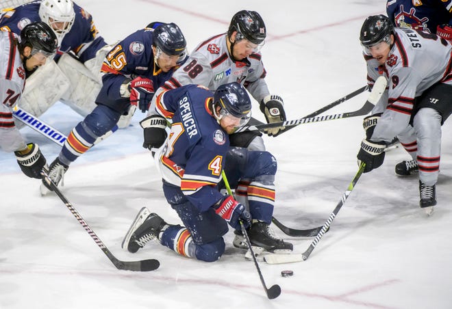 Peoria's Chase Spencer (4) battles Huntsville's Phil Elgstam (88) and Dylan Stewart in the third period of Game 2 of the SPHL President's Cup finals Saturday, April 27, 2024 at the Peoria Civic Center. The Rivermen forced a Game 3 with a 6-4 victory.