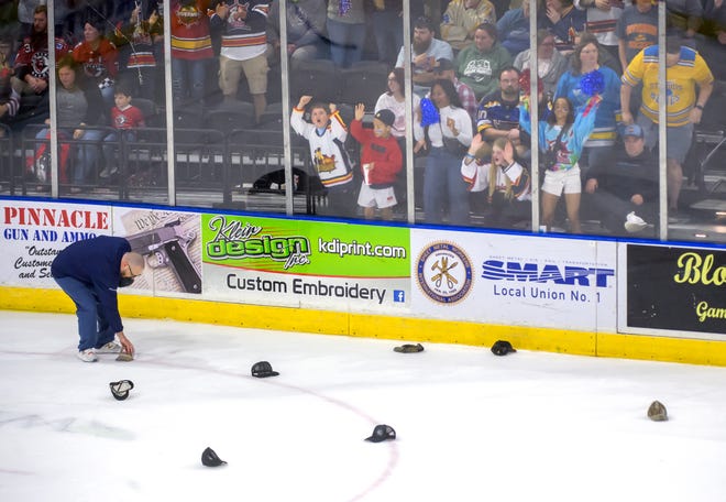 Fans cheer as hats fall to the ice after Peoria's Alec Hagaman completed a hat trick on an empty-netter against Huntsville in the third period of Game 2 of of the SPHL President's Cup finals Saturday, April 27, 2024 at the Peoria Civic Center. The Rivermen forced a Game 3 with a 6-4 victory.