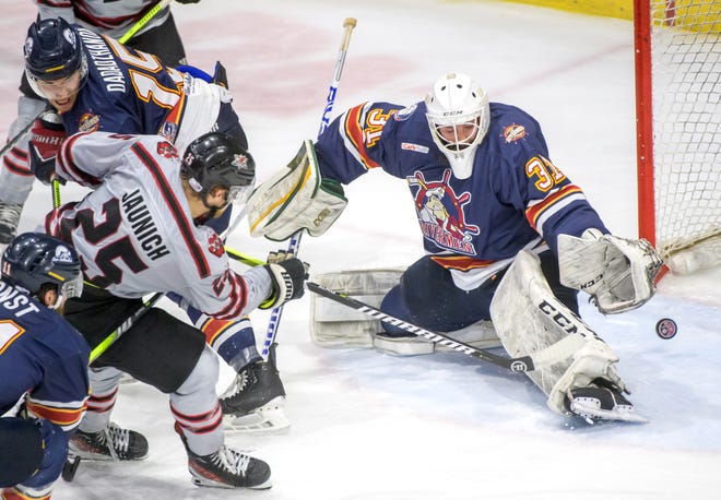 Huntsville's Jack Jaunich (25) slips the puck past Peoria goaltender Nick Latinovich for a goal in the second period of Game 2 of the SPHL President's Cup finals Saturday, April 27, 2024 at the Peoria Civic Center. The Rivermen forced a Game 3 with a 6-4 victory.