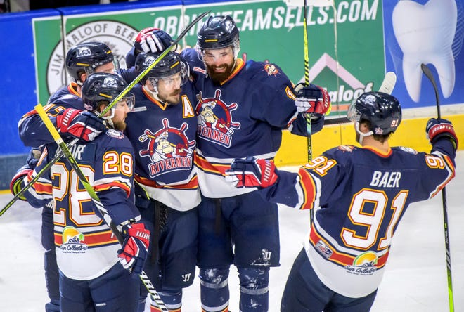 The Peoria Rivermen celebrate a goal against Huntsville by teammate Zach Wilkie, middle, in the first period of Game 2 of the SPHL President's Cup finals Saturday, April 27, 2024 at the Peoria Civic Center. The Rivermen forced a Game 3 with a 6-4 victory.
