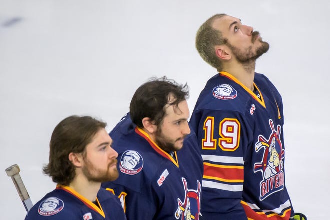 Peoria's Zach Wilkie, right, gazes into the rafters as the Rivermen stand for the national anthem before the start of Game 2 of the SPHL President's Cup finals Saturday, April 27, 2024 at the Peoria Civic Center. The Rivermen forced a Game 3 with a 6-4 victory over the Huntsville Havoc.
