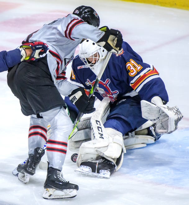 Peoria goaltender Nick Latinovich stops a shot from Huntsville's Eric Henderson in the second period of the deciding game of the SPHL President's Cup finals Sunday, April 28, 2024 at the Peoria Civic Center.