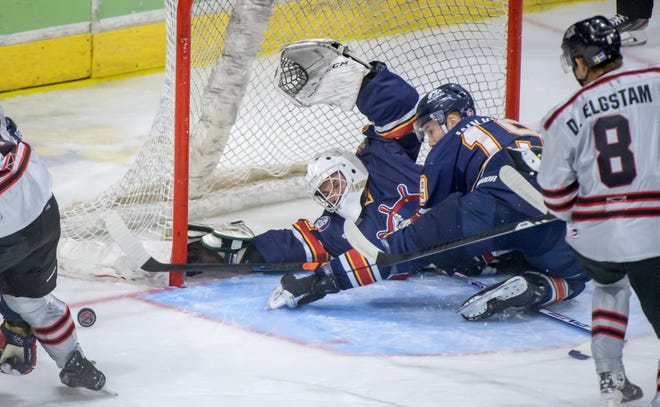 Peoria goaltender Nick Latinovich and defenseman Zach Wilkie slide across the crease to stop the puck against the Huntsville Havoc in the first period of the deciding game of the SPHL President's Cup finals Sunday, April 28, 2024 at the Peoria Civic Center.