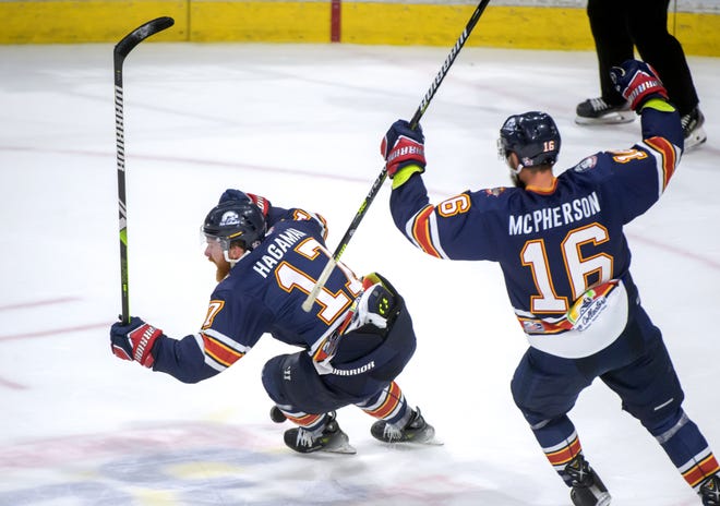 Peoria's Alec Hagaman (17) and Mitch McPherson celebrate Hagaman's empty-net goal against the Huntsville Havoc in the third period of the deciding game of the SPHL President's Cup finals Sunday, April 28, 2024 at the Peoria Civic Center.