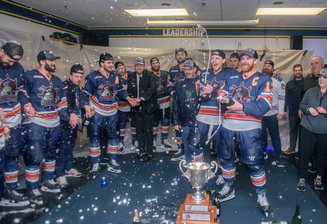 Peoria's Alec Hagaman (17) and JM Piotrowski let loose some champagne spray in the Rivermen locker room after their 5-1 victory over the Huntsville Havoc in the deciding game of the SPHL President's Cup finals Sunday, April 28, 2024 at the Peoria Civic Center.