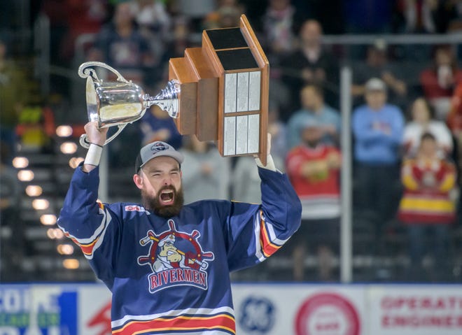 Peoria Rivermen defenseman Mitch McPherson celebrates with the President's Cup after the team's 5-1 victory over the Huntsville Havoc in the deciding game of the SPHL President's Cup finals Sunday, April 28, 2024 at the Peoria Civic Center.