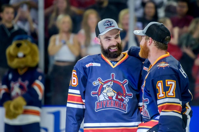 Peoria's Mitch McPherson, left, and Alec Hagaman share a moment after the Rivermen defeated the Huntsville Havoc 5-1 in the deciding game of the SPHL President's Cup finals Sunday, April 28, 2024 at the Peoria Civic Center.