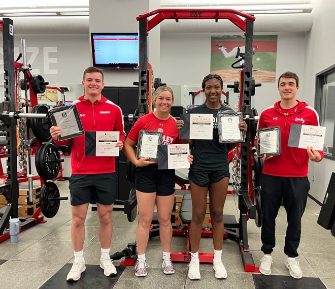 Bradley University athletes (left to right) Eli Rieker, Abbot Badgley, Isis Fitch and Connor Hickman, plus Ryan Vogel (not pictured) celebrate their national recognition awards for their performance in the strength and conditioning program.