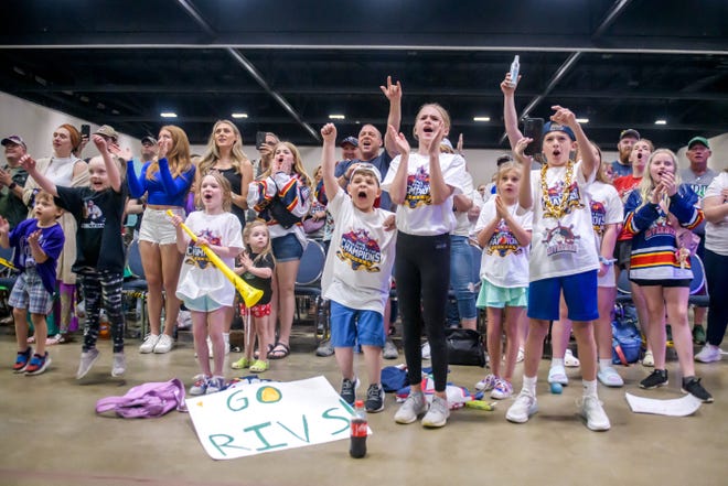 Peoria Rivermen fans, including a group of enthusiastic youngsters at the front, cheer for the team as they're introduced during a public celebration for their SPHL President's Cup hockey championship Friday, May 3, 2024 at the Peoria Civic Center.